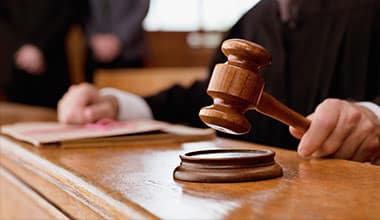Judge with wooden gravel on the A-1 Anytime Bonding website for bail bonds in Panama City Florida